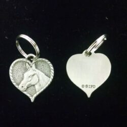 A heart shaped ring with a horse image