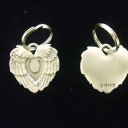 Two heart shaped ring with a black background