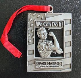 Pearl Harbor locket with a red ribbon