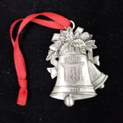 Some bells design locket with a red ribbon