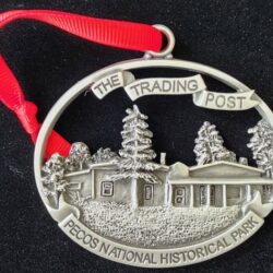 A pewter ornament of The Trading Post at Pecos National Historical Park.