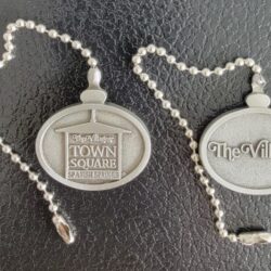 The Villages Town Square metal keychain tokens